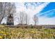 Community sign and entrance surrounded by nature and landscaping on a sunny day at 42363 Glen Abbey Dr, Elizabeth, CO 80107