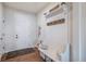 Inviting entryway featuring a storage bench, coat hooks and decor at 42363 Glen Abbey Dr, Elizabeth, CO 80107