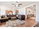 Open-concept living room with a sectional sofa and an adjacent kitchen creates a seamless living space at 42363 Glen Abbey Dr, Elizabeth, CO 80107