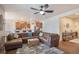Open concept living room and kitchen area with sleek ceiling fan and comfortable seating at 42363 Glen Abbey Dr, Elizabeth, CO 80107