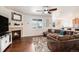 Comfortable living room with a fireplace, a large window, and a cozy sectional sofa for Gathering gatherings at 42363 Glen Abbey Dr, Elizabeth, CO 80107