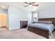 Serene bedroom with neutral walls, a large window, carpet floors, and stylish furnishings at 42363 Glen Abbey Dr, Elizabeth, CO 80107