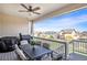 Covered patio area with beautiful view, ceiling fan, dining table and grill at 42363 Glen Abbey Dr, Elizabeth, CO 80107