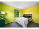 Vibrant bedroom with large window, modern bed frame, and stylish bedside decor at 17395 E Dewberry Dr, Parker, CO 80134