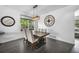 Modern dining area with hardwood floors, stylish lighting, and decor at 17395 E Dewberry Dr, Parker, CO 80134