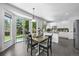 Bright eat-in kitchen with white cabinets, dark countertops and modern appliances at 17395 E Dewberry Dr, Parker, CO 80134