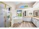 Bright main bathroom features a glass-enclosed shower, soaking tub, and dual vanities with ample counter space at 17395 E Dewberry Dr, Parker, CO 80134