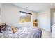 Comfortable bedroom features plush bedding, mountain views, and ample closet space at 2221 Illinois St, Golden, CO 80401