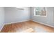 The bedroom offers wood floors, neutral walls and great natural lighting at 2221 Illinois St, Golden, CO 80401