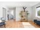 Bedroom with hardwood floors, light gray walls and doorway to an adjacent bathroom at 2221 Illinois St, Golden, CO 80401