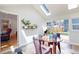 Bright breakfast nook with skylight, tile floor, and sliding doors to outdoor space at 2221 Illinois St, Golden, CO 80401