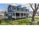 Charming two-story home with a welcoming front porch and well-kept lawn at 2221 Illinois St, Golden, CO 80401
