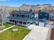 Stunning two-story home with a large front porch and beautiful mountain views at 2221 Illinois St, Golden, CO 80401