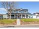 Charming two-story home features a spacious porch, well-manicured lawn, and inviting curb appeal at 2221 Illinois St, Golden, CO 80401