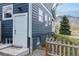 View of home's exterior with blue siding, white trim, and a well-maintained landscape at 2221 Illinois St, Golden, CO 80401