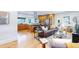 Open-concept living room with hardwood floors and a kitchen island at 2221 Illinois St, Golden, CO 80401