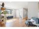 Sunlit living room with hardwood floors, comfortable seating, and a picturesque outdoor view at 2221 Illinois St, Golden, CO 80401