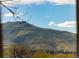 Stunning mountain views visible through the house's windows at 2221 Illinois St, Golden, CO 80401