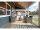 Stylish porch with wicker furniture, a cozy rug, and a serene ambiance perfect for relaxing and enjoying the outdoors at 2221 Illinois St, Golden, CO 80401