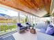 Spacious covered porch with comfortable seating and scenic views at 2221 Illinois St, Golden, CO 80401