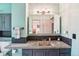 Charming bathroom with custom vanity, lighting, and decorative backsplash at 6678 S Arapahoe Dr, Littleton, CO 80120