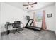 Bedroom featuring a treadmill, desk, ceiling fan, and natural light from the window at 6678 S Arapahoe Dr, Littleton, CO 80120