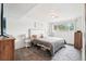This is a bedroom featuring neutral colors and a large window at 6678 S Arapahoe Dr, Littleton, CO 80120
