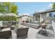 Spacious deck with outdoor furniture, a grill, and steps leading to the backyard at 6678 S Arapahoe Dr, Littleton, CO 80120