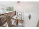 Bright entryway with modern lighting fixtures and staircase at 6678 S Arapahoe Dr, Littleton, CO 80120