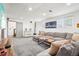 Finished basement featuring plush sectional, modern decor, and recessed lighting at 6678 S Arapahoe Dr, Littleton, CO 80120