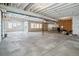 Unfinished basement with concrete floor, exposed ceiling and structural elements, and natural light at 8299 S Kellerman, Aurora, CO 80016