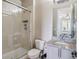 Bathroom with a glass shower, gray cabinets, granite countertops, and ample lighting at 8299 S Kellerman, Aurora, CO 80016