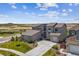 Attractive home displaying stone accents, a three-car garage, and meticulous landscaping at 8299 S Kellerman, Aurora, CO 80016