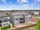 Aerial view of a two-story home with a backyard, wooden fence, and professional landscaping at 8299 S Kellerman, Aurora, CO 80016
