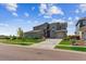 Charming two-story home with a three-car garage, complemented by a well-maintained lawn at 8299 S Kellerman, Aurora, CO 80016