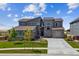 Inviting two-story home with beautiful stone accents and manicured landscaping at 8299 S Kellerman, Aurora, CO 80016