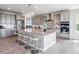 Spacious kitchen features a large island, granite countertops, stainless steel appliances, and ample cabinet space at 8299 S Kellerman, Aurora, CO 80016