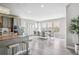 Open kitchen has an adjacent eating area with an abundance of natural light and views at 8299 S Kellerman, Aurora, CO 80016
