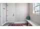 Charming mud room with storage bench, decorative tile flooring, and bright natural light at 8299 S Kellerman, Aurora, CO 80016