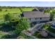Backyard with artificial grass, a white fence, and surrounding landscaping at 1743 Homestead Dr, Fort Lupton, CO 80621