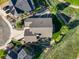 Aerial view of the property showcasing the house's layout, landscaping, and surrounding neighborhood at 1743 Homestead Dr, Fort Lupton, CO 80621