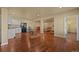 Large basement with wood floors, a kitchenette, and plenty of open space for recreation at 1743 Homestead Dr, Fort Lupton, CO 80621