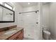 Bathroom featuring a shower and tub combination, a modern vanity, and a toilet at 1743 Homestead Dr, Fort Lupton, CO 80621