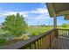 Spacious deck with a view of a golf course and landscaped grounds at 1743 Homestead Dr, Fort Lupton, CO 80621