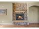 Close up of the stone fireplace with a mantel and hearth at 1743 Homestead Dr, Fort Lupton, CO 80621