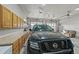 Spacious garage with ample storage, featuring built-in cabinets and a durable concrete floor at 1743 Homestead Dr, Fort Lupton, CO 80621
