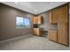 Office space with natural wood cabinetry and a large window with outdoor views at 1743 Homestead Dr, Fort Lupton, CO 80621