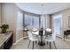 Cozy breakfast nook with a round table and built-in window seating at 3423 Princeton Pl, Broomfield, CO 80023