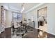 Bright dining room features hardwood floors and an open view to the kitchen at 3423 Princeton Pl, Broomfield, CO 80023