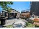 Spacious backyard with a modern garage, hammock, stylish seating, and patio area at 3618 Navajo St, Denver, CO 80211